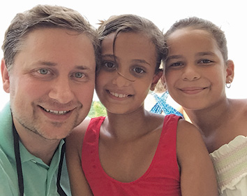 Alan Morris with two happy little girls